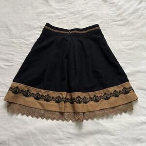 Axes Femme black skirt with gold brown lace trim and velvet ribbon